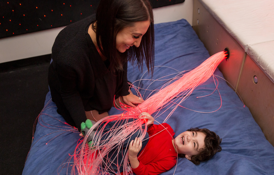 child with sensory lights