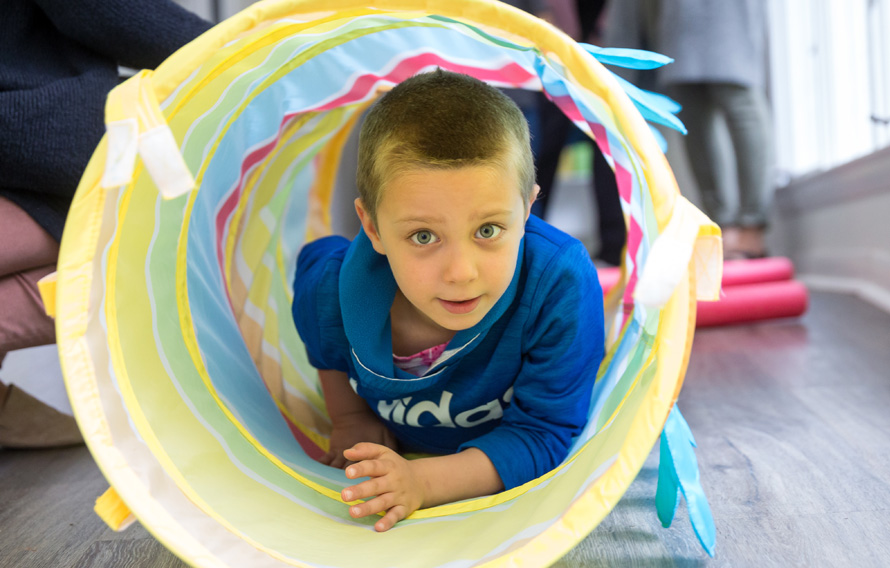 boy in play tunnel