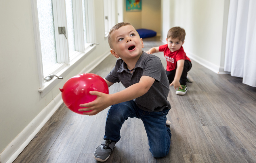 Boys playing with balloon