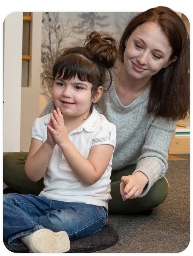 Woman teaching kid at Talcot Center