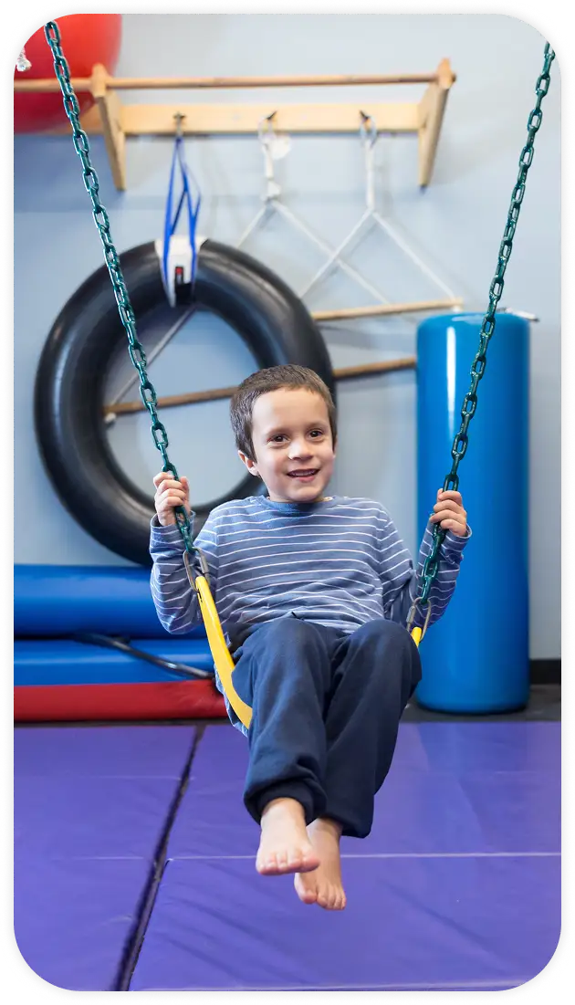 Boy on a swing at Talcott Center