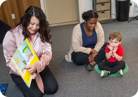 Women playing with kid